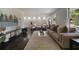 Bright and airy living room with modern furnishings, hardwood floors, and a painted brick accent wall at 4214 Williamsburg Dr, College Park, GA 30337