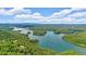 Scenic aerial view captures a home nestled amongst the lush greenery along Lake Lanier's shoreline at 52 Waterside Se Dr, Cartersville, GA 30121