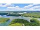 Stunning aerial view of Lake Lanier with its tree-covered islands and inlets under a beautiful clouded sky at 52 Waterside Se Dr, Cartersville, GA 30121