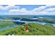 Aerial view of the property on Lake Keowee showcasing its prime location amidst lush forests and calm waters at 52 Waterside Se Dr, Cartersville, GA 30121