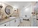 Charming bathroom featuring a clawfoot tub, patterned tile flooring, and a round mirror at 52 Waterside Se Dr, Cartersville, GA 30121