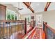 Second-floor bonus room with desk, seating, hardwood floors and ample natural light at 52 Waterside Se Dr, Cartersville, GA 30121