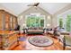 Comfortable bonus room features vaulted ceiling, plush seating, and a view of the backyard at 52 Waterside Se Dr, Cartersville, GA 30121