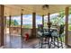 Covered deck with outdoor seating, offering stunning views of the surrounding landscape at 52 Waterside Se Dr, Cartersville, GA 30121