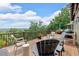 Relaxing deck area boasts outdoor seating, a grill, and stunning vistas of the lush landscape at 52 Waterside Se Dr, Cartersville, GA 30121