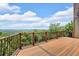 Well-maintained wooden deck with panoramic views of the scenic landscape and natural beauty at 52 Waterside Se Dr, Cartersville, GA 30121