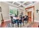Dining room features hardwood floors, tray ceilings, neutral paint, large windows, and custom molding and millwork at 52 Waterside Se Dr, Cartersville, GA 30121