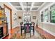 Dining room features hardwood floors, a large picture window, neutral paint, tray ceilings, and custom molding and millwork at 52 Waterside Se Dr, Cartersville, GA 30121