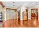 Entryway showcasing beautiful hardwood floors and a craftsman style door at 52 Waterside Se Dr, Cartersville, GA 30121