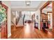 Spacious foyer showcasing hardwood floors, staircase, and a view into the living room at 52 Waterside Se Dr, Cartersville, GA 30121