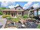 Beautiful home featuring a stone fire pit and lush landscaping at 52 Waterside Se Dr, Cartersville, GA 30121