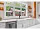 Bright and airy kitchen sink with view to the back of the property at 52 Waterside Se Dr, Cartersville, GA 30121