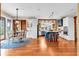 Bright eat-in kitchen with hardwood floors, stainless steel appliances, an island with seating, and access to the back deck at 52 Waterside Se Dr, Cartersville, GA 30121