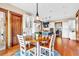 Bright eat-in kitchen boasts hardwood floors, white cabinets, stainless steel appliances, and views into the breakfast nook at 52 Waterside Se Dr, Cartersville, GA 30121