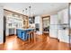 Modern kitchen with island, stainless steel appliances, and hardwood floors at 52 Waterside Se Dr, Cartersville, GA 30121