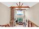 Second story view of the living room features stone fireplace and hardwood flooring at 52 Waterside Se Dr, Cartersville, GA 30121