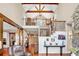 Open-concept living room boasts soaring ceilings, wood beams, and an abundance of natural light at 52 Waterside Se Dr, Cartersville, GA 30121