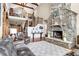 Grand living room featuring a stone fireplace, wood beams and an open floor plan at 52 Waterside Se Dr, Cartersville, GA 30121