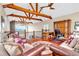Upstairs living area featuring exposed wood beams, wood floors, and a desk at 52 Waterside Se Dr, Cartersville, GA 30121