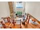 Bright living room features a stone fireplace, comfortable seating, and stunning mountain views at 52 Waterside Se Dr, Cartersville, GA 30121