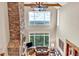Bright living room with stone fireplace, hardwood floors, and large windows with mountain views at 52 Waterside Se Dr, Cartersville, GA 30121