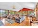 Spacious living room with hardwood floors, multiple seating areas, and large windows at 52 Waterside Se Dr, Cartersville, GA 30121