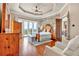 Tranquil main bedroom featuring a private balcony and decorative trey ceiling at 52 Waterside Se Dr, Cartersville, GA 30121