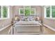 Cozy main bedroom featuring neutral tones, large windows, and ample natural light at 52 Waterside Se Dr, Cartersville, GA 30121