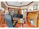 Spacious home office with built-in bookcase, wood accents and desk, ideal for remote work at 52 Waterside Se Dr, Cartersville, GA 30121
