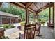 Charming covered porch with stone flooring and rocking chairs at 52 Waterside Se Dr, Cartersville, GA 30121