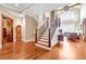 Elegant staircase with wood and iron detailing, open to the living room at 52 Waterside Se Dr, Cartersville, GA 30121