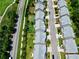 Overhead shot of a neighborhood's orderly rows of homes, each with its private backyard and driveway at 6468 Panasa Ct, Tucker, GA 30084