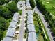 Scenic overhead view of residences adjacent to a golf course, combining residential charm with recreational access at 6468 Panasa Ct, Tucker, GA 30084