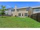 Backyard view with green grass and privacy fence at 6468 Panasa Ct, Tucker, GA 30084