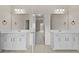 Bright bathroom with double sink vanities and tile flooring at 6468 Panasa Ct, Tucker, GA 30084