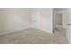 This carpeted bedroom offers closet space and easy access to other areas of the home and has natural lighting at 6468 Panasa Ct, Tucker, GA 30084