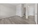Bedroom features a closet and entrance to the ensuite bathroom and boasts stylish grey flooring and a neutral color palette at 6468 Panasa Ct, Tucker, GA 30084