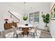 Bright dining room featuring a modern table with seating for four and contemporary decor at 6468 Panasa Ct, Tucker, GA 30084