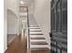 Welcoming entryway featuring hardwood floors, a staircase, and an open floor plan with lots of natural light at 6468 Panasa Ct, Tucker, GA 30084
