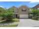 Inviting two-story home with brick and siding exterior, complemented by a well-manicured lawn and a driveway at 6468 Panasa Ct, Tucker, GA 30084