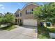 Charming two-story brick home featuring a two-car garage, well-kept lawn, and inviting curb appeal at 6468 Panasa Ct, Tucker, GA 30084