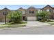 Traditional two-story home with a well-kept lawn, two-car garage, and inviting entrance at 6468 Panasa Ct, Tucker, GA 30084