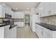 Bright kitchen with stainless appliances, white cabinets, and sleek countertops at 6468 Panasa Ct, Tucker, GA 30084