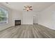 Spacious living room with sleek floors and a fireplace at 6468 Panasa Ct, Tucker, GA 30084