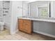 Bathroom featuring a vanity with granite countertop and tub with shower at 106 Brighton Pt, Sandy Springs, GA 30328