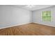 Bedroom featuring hardwood floors and a window with a view of trees at 106 Brighton Pt, Sandy Springs, GA 30328