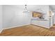Open dining area featuring hard surface floors and modern chandelier at 106 Brighton Pt, Sandy Springs, GA 30328