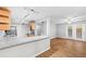 Bright kitchen with granite countertops and stainless appliances open to living space at 106 Brighton Pt, Sandy Springs, GA 30328