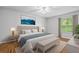 Serene main bedroom with a plush bed, bench, and natural light, creating a relaxing retreat at 106 Brighton Pt, Sandy Springs, GA 30328