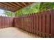 Private back patio enclosed by a wooden fence, offering a cozy outdoor space at 106 Brighton Pt, Sandy Springs, GA 30328